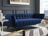 Embolden your living room décor with the Tipper Modern Sofa. Featuring a blend of chic, contemporary, and mid-century modern design, It's broad profile, deep seating, generous tufting, stain-resistant velvet polyester upholstery, flared armrests, and subtle metal accents imbue rich detail and chic sophistication