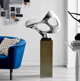 Chrome Abstract Floor Sculpture on Grey Base