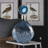Sky blue iridescent glass with blue sugar spun accents and brushed nickel plated removable lid with blue agate stone displayed in the center of the iron circle.