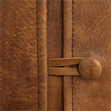 thick top grain nubuck leather slipcover chair in a distressed worn cognac with a tailored double stitched design and casual flange edges