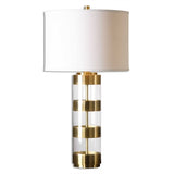 Metal bands finished in a plated brushed brass separated by clear acrylic details. The round hardback drum shade is a light beige linen fabric with natural slubbing.