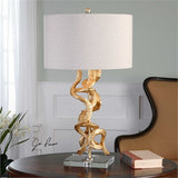 Inspired from real twisted vines, this lamp has a bright gold leaf finish accented with a thick crystal foot and matching finial. The round hardback drum shade is an oatmeal linen fabric.