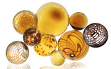Glass round wall art colored in browns, ambers, leopard, and dark brown