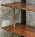 Etagere in an antique brass finish with suspended dark honey stained display shelves
