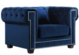The Oak Modern Accent chair is a great choice to add to your contemporary living room. The Velvet Upholstery, deep tufts, and chrome nailhead trim works well together to provide a beautiful seating collection. Modern and stately.  Works great in modern and transitional interiors.  Several colors available.