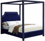 The Tailored Canopy Bed features a velvet-clad canopy that beckons you to rest like royalty. The deeply detailed tufting on the scalloped headboard makes for a sumptuous presentation, and the chrome nail heads add to the luxe look of this exquisite bed.