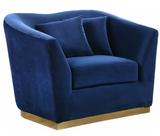 The Slope Modern Accent Chair is graceful and stylish. This handsome sofa is upholstered in velvet for a glamorous touch and is accented with gold stainless steel around its base for a touch of modernity. Its curvy back gives it a graceful look in your living room or den, and it comes with coordinating throw pillows that beckon you to sit down and rest (or nap) for a spell.