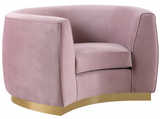 The Shell Accent Chair comes upholstered in rich, sumptuous-to-the-touch velvet in a unique offering of color to make a fashionable statement in your space. The unexpected color creates a cheery feel and stands out amid other neutral colors in your existing decor. The curved back design lends it a modish touch, and the gold stainless steel trim around its base adds to its glitzy appeal. Or the sleek stainless steel base if you prefer.