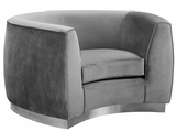 The Shell Accent Chair comes upholstered in rich, sumptuous-to-the-touch velvet in a unique offering of color to make a fashionable statement in your space. The unexpected color creates a cheery feel and stands out amid other neutral colors in your existing decor. The curved back design lends it a modish touch, and the gold stainless steel trim around its base adds to its glitzy appeal. Or the sleek stainless steel base if you prefer.