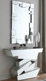 Elevate your interior with this Jagged mirrored console table. This handsome table features a staggered geometric base that makes it look more like an intricate sculpture than the actual piece of furniture it is. Every surface of the base is mirrored, so it reflects light and adds spacious appeal and dimension to your space. The top is made from thick glass and amply sized to hold collectibles or photos.