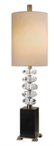 The Clearstone Table Lamp Is big on style and design. Stacked, thick crystal eggs, separated by antique brass steel columns, displayed on a chunky black marble foot. The tall round hardback shade is a light beige linen fabric. Add a unique edge to your lighting.