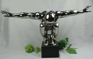 Chrome Man with Outstretched Arms on Black Base