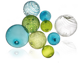 Glass ball wall art in aqua blue, lime green, and clear