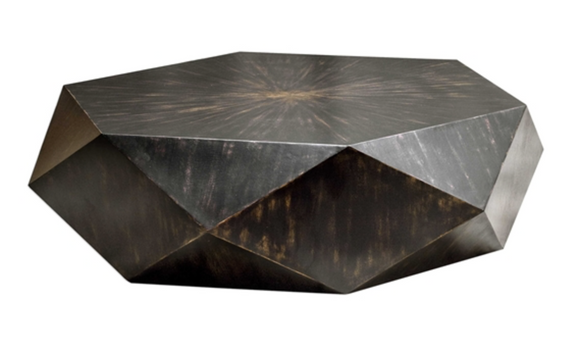 geometric table features a low profile, perfect for viewing the sunburst top in mango veneer with a worn black finish