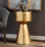 this accent table is finished in hand applied metallic gold leaf with a black glass inset top