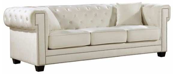 The Oak Modern Sofa Collection is a great choice to add to your contemporary living room. The Velvet Upholstery, deep tufts, and chrome nailhead trim works well together to provide a beautiful seating collection. 
