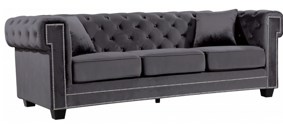 The Oak Modern Sofa Collection is a great choice to add to your contemporary living room. The Velvet Upholstery, deep tufts, and chrome nailhead trim works well together to provide a beautiful seating collection. 