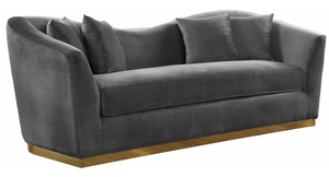 The Slope Modern Sofa Collection is graceful and stylish. This handsome sofa is upholstered in velvet for a glamorous touch and is accented with gold stainless steel around its base for a touch of modernity. Its curvy back gives it a graceful look in your living room or den, and it comes with coordinating throw pillows that beckon you to sit down and rest (or nap) for a spell.
