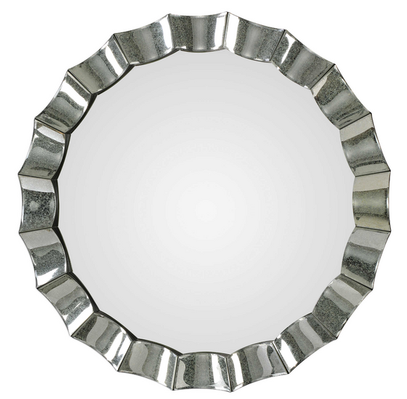 The Antiqued scalloped edge round mirror is striking. This frame features individual antiqued mirrors with a scalloped design and subtle beveled edges. Make a bold statement with this unique wall mirror.