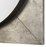 The Introvert Wall Mirror is modern and simple. Heavy iron frame finished in a hand applied metallic silver leaf, accented with a raised rustic black center. Mirror features a generous 1 1/4" bevel.