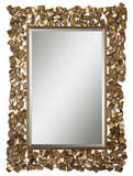 The Fragment Wall mirror has a unique flare. Metal strips are welded together to create this ornate frame. The antiqued gold leaf finish has a light gray glaze. Mirror has a generous 1 1/4" bevel. May be hung horizontal or vertical.