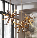 The Jagged Starburst 6 light pendant features antique gold leaf on starburst blades helps mix the mid-century feel with an old world feel giving us this great pendant. Includes 6-40w G9 halogen bulbs. Use in a grouping for a more eye catching fixture.